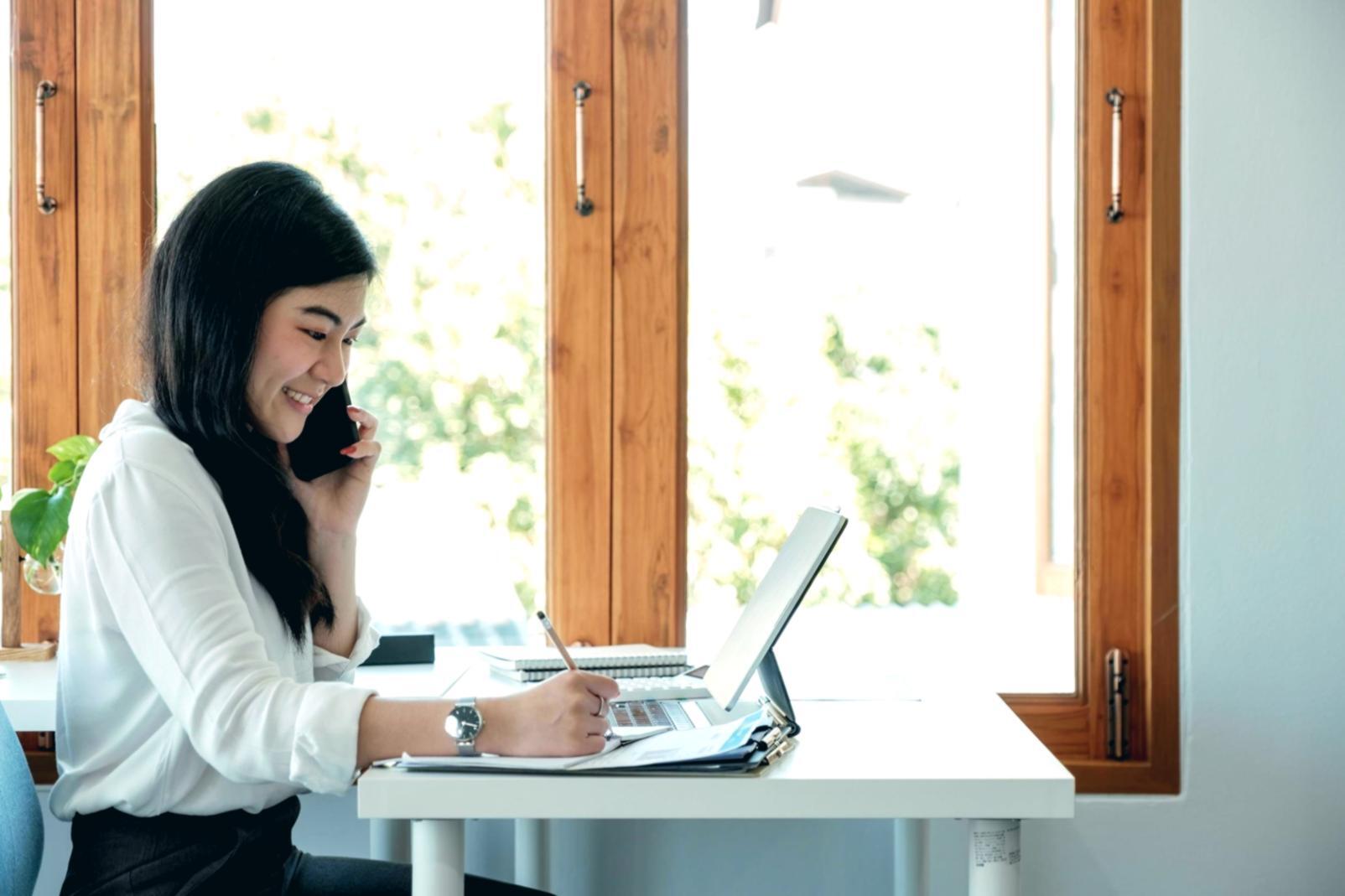 Financial planning workspace with charts and business documents